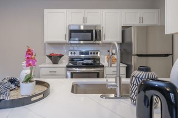 Custom kitchen cabinets with quartz countertops *